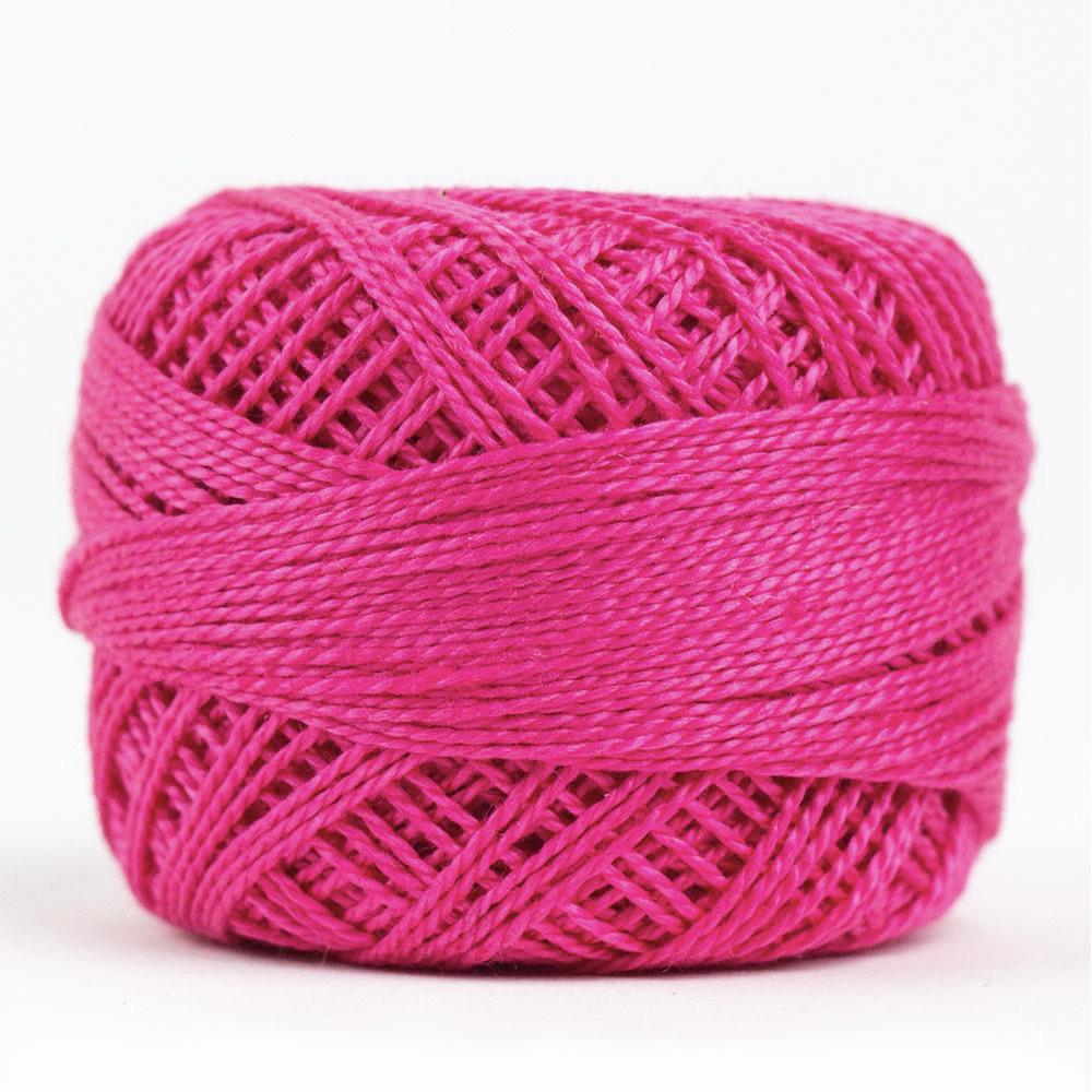 Side view of Perle cotton ball on white background to show color