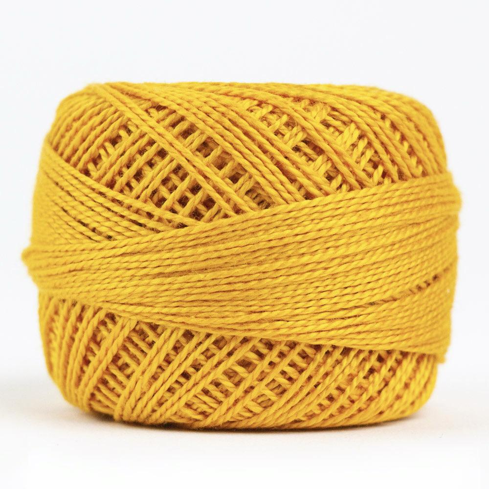 Side view of Perle cotton ball on white background to show color