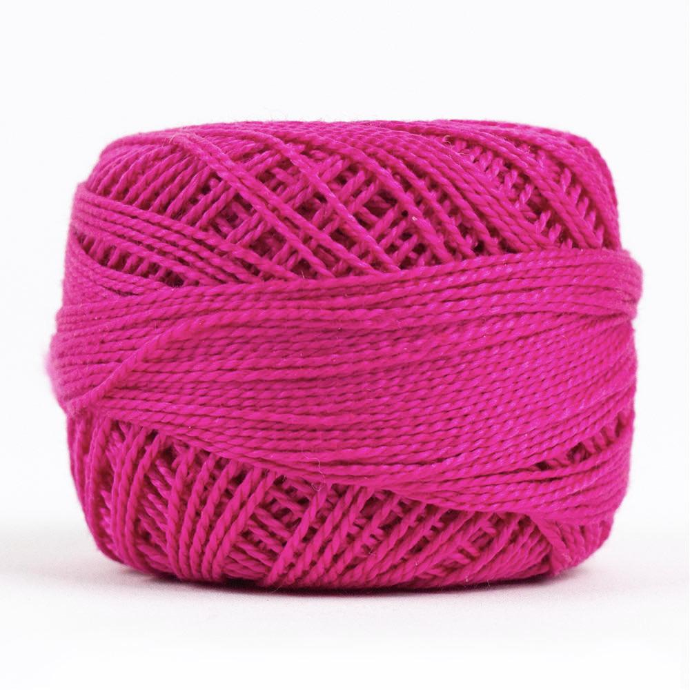 Side view of Perle cotton ball on white background to show color