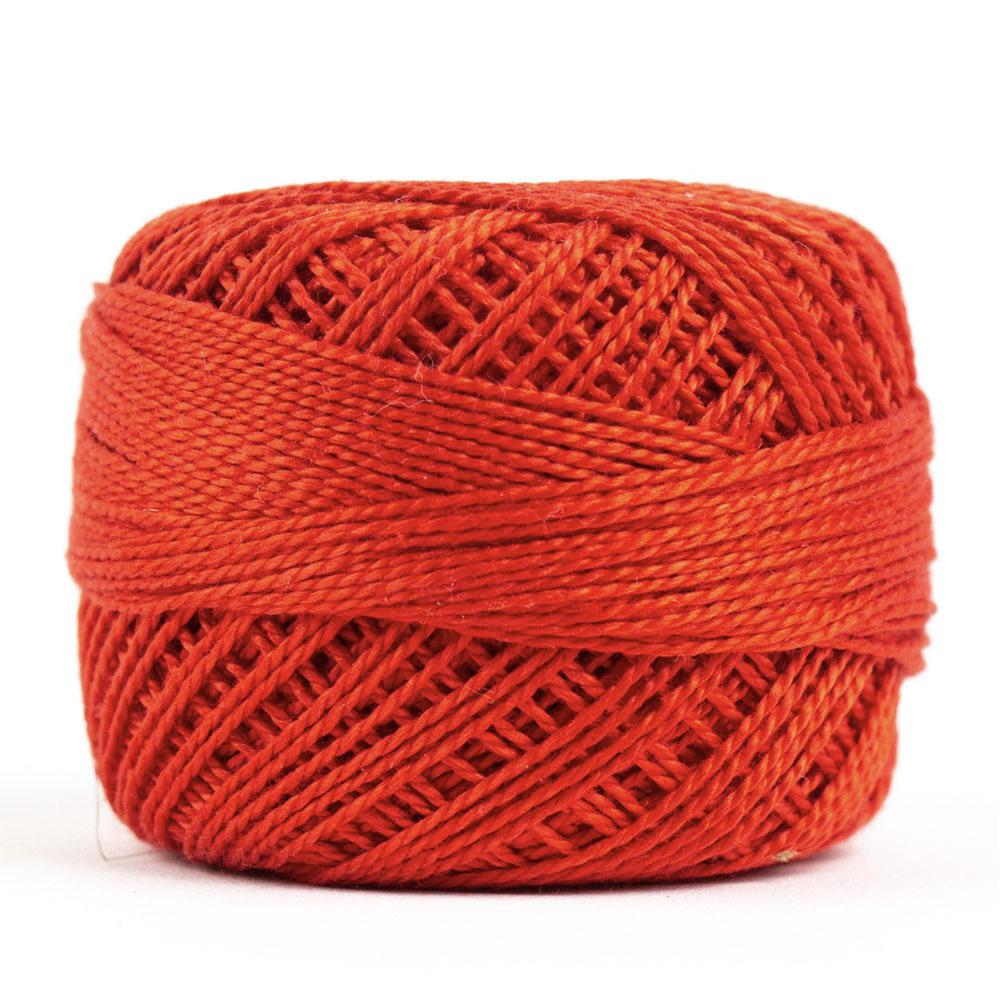 Side view of Perle cotton ball on white background to show color