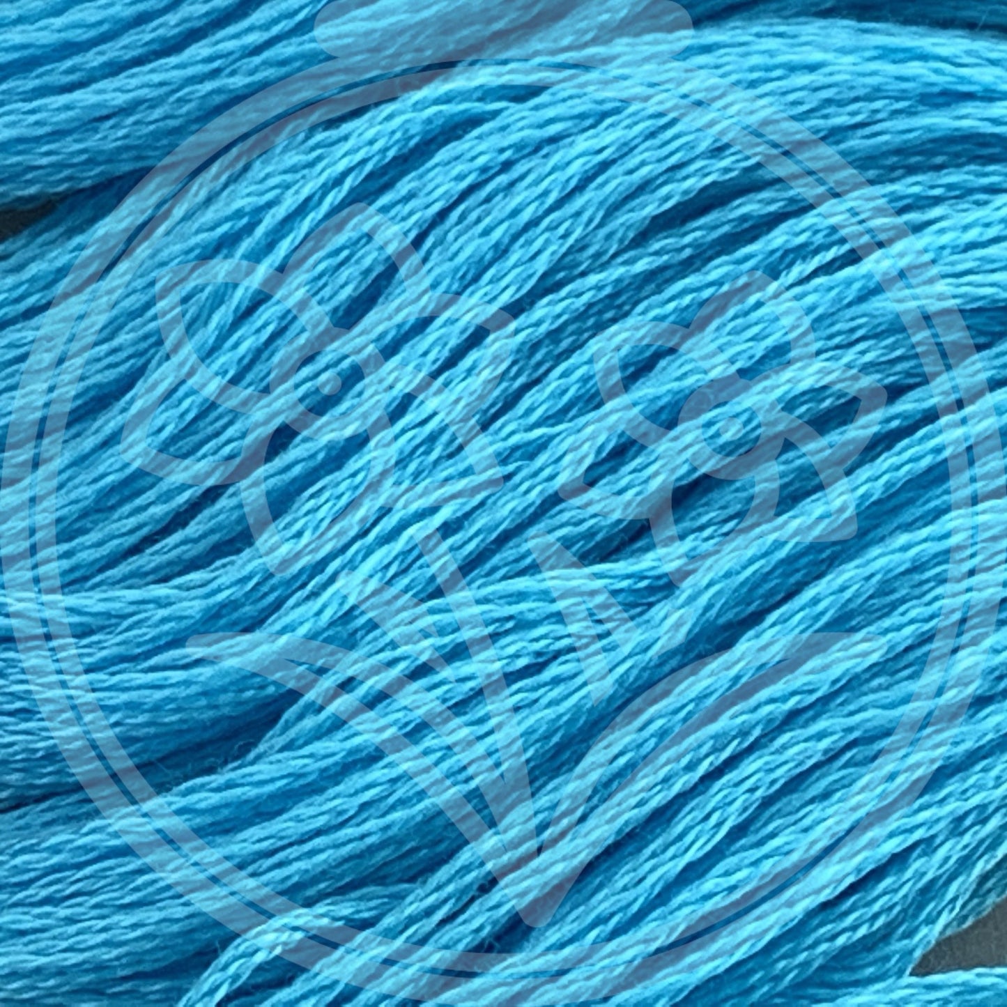 Closeup of multiple skeins, with a logo watermark