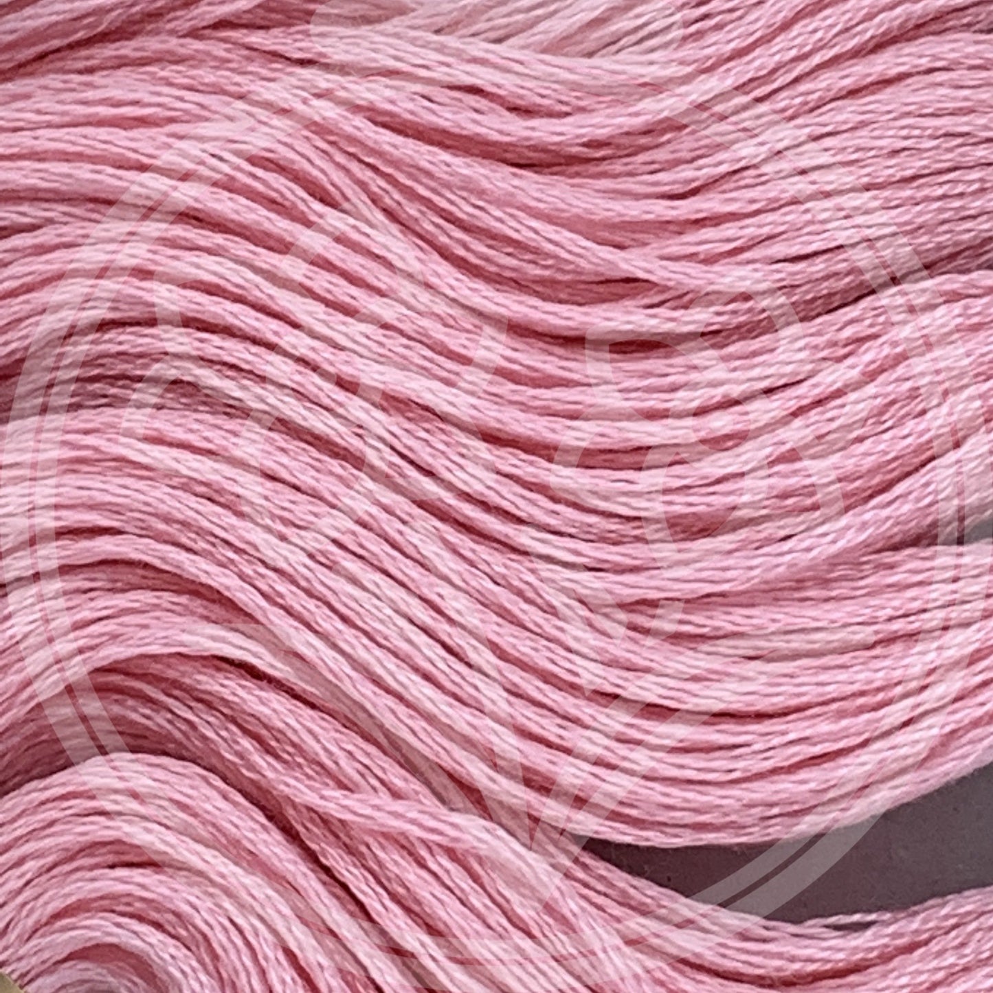 Closeup of multiple skeins, with a logo watermark