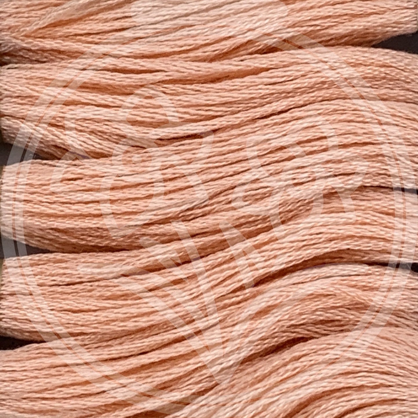 Closeup of multiple skeins, with a logo watermark
