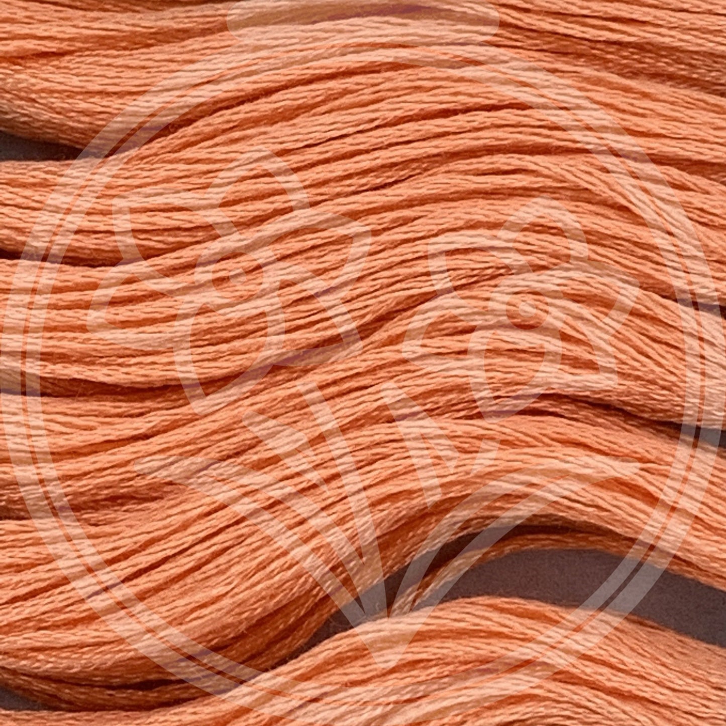 Closeup of multiple skeins, with a logo watermark