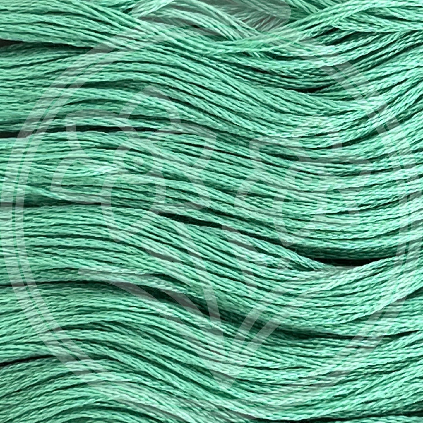 Closeup of multiple skeins, with a logo watermark