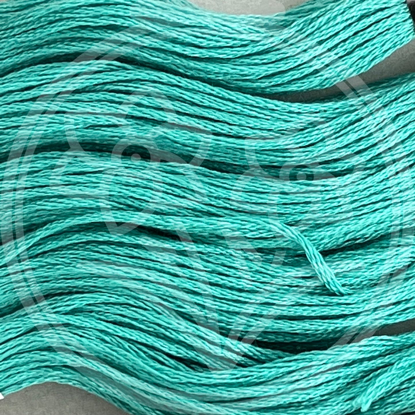 Closeup of multiple skeins, with a logo watermark