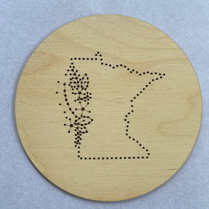 Wooden embroidery disk with a pre-patterned design of Michigan. 
