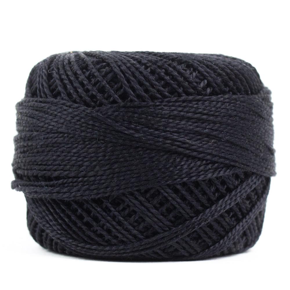 Side view of Perle cotton ball on white background to show color