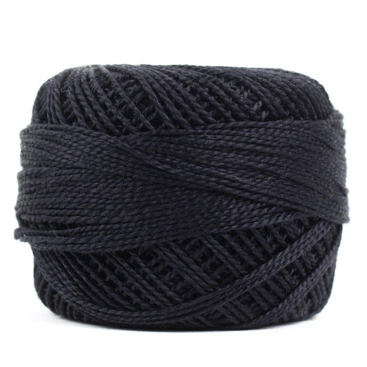 Side view of Perle cotton ball on white background to show color