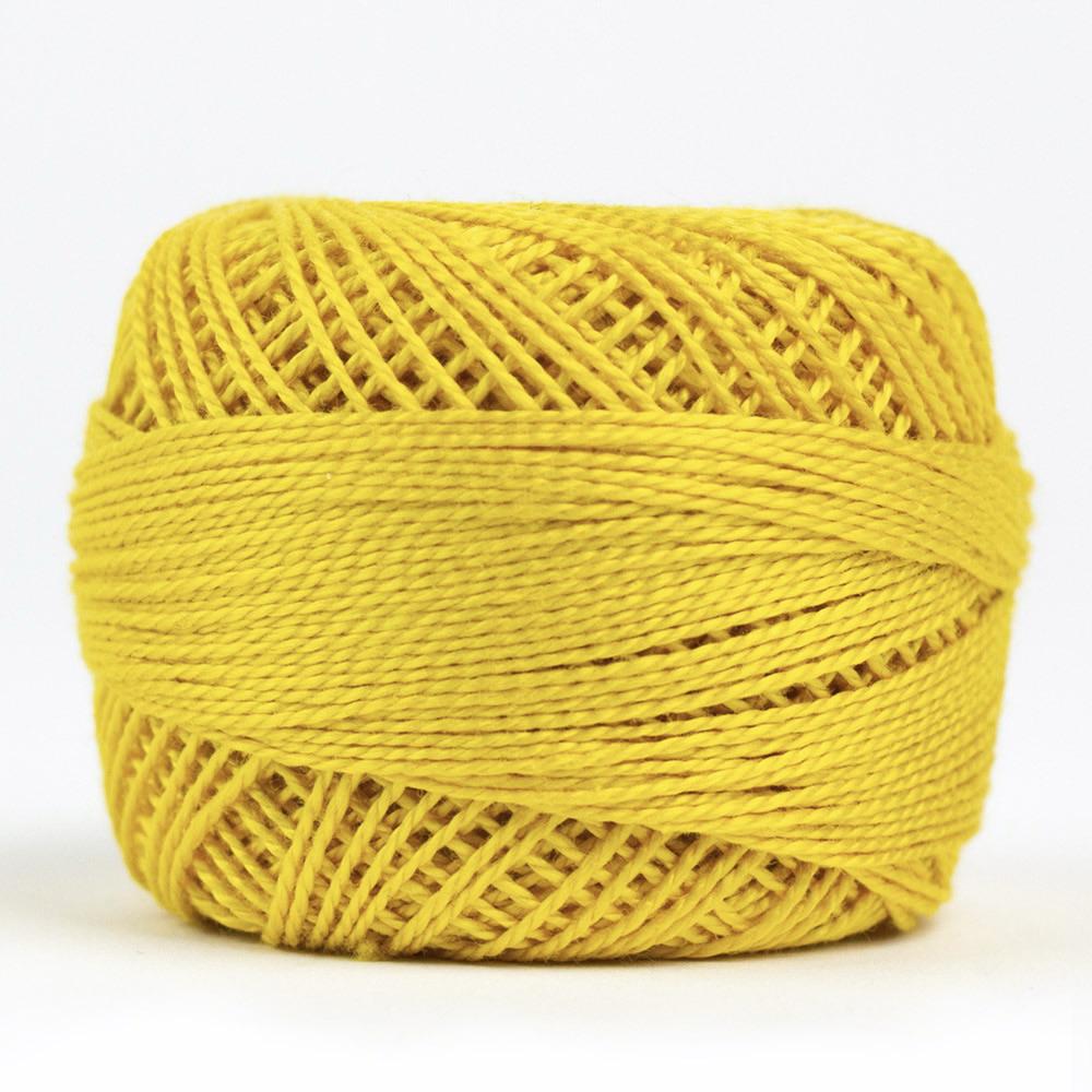 Side view of Perle cotton ball on white background to show color