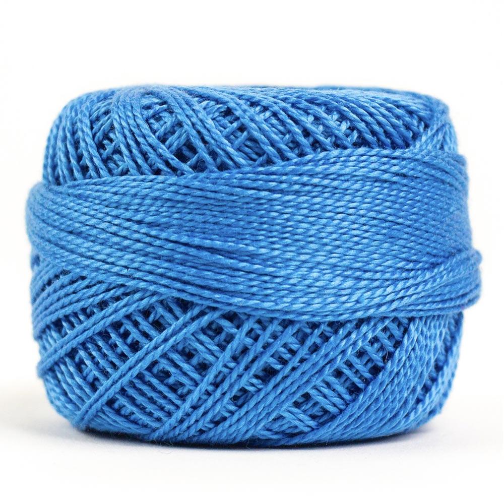 Side view of Perle cotton ball on white background to show color