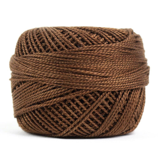 Side view of Perle cotton ball on white background to show color