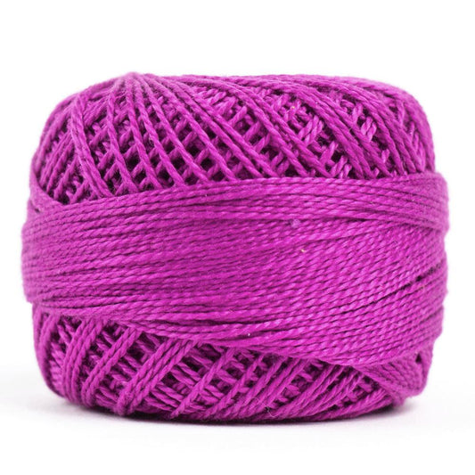 Side view of Perle cotton ball on white background to show color