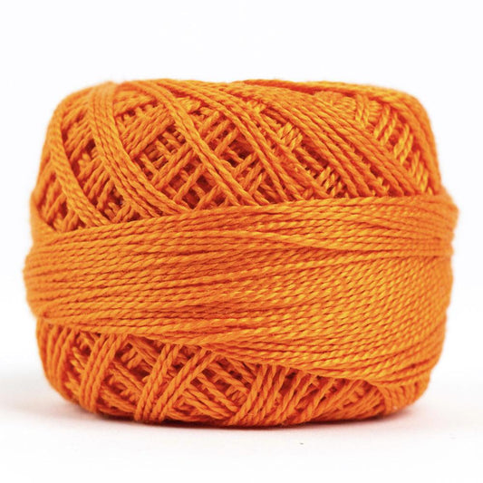 Side view of Perle cotton ball on white background to show color