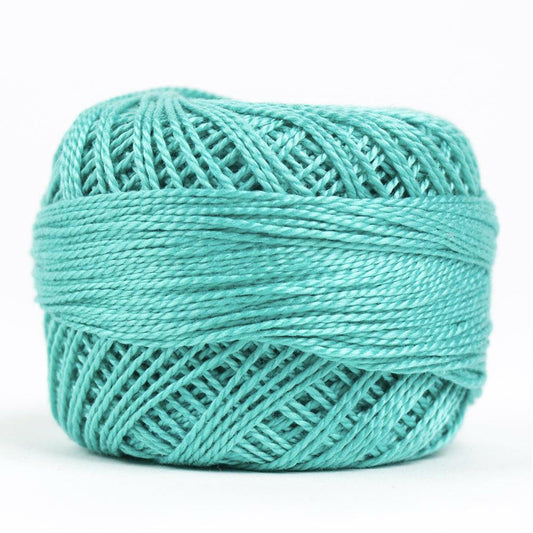 Side view of Perle cotton ball on white background to show color