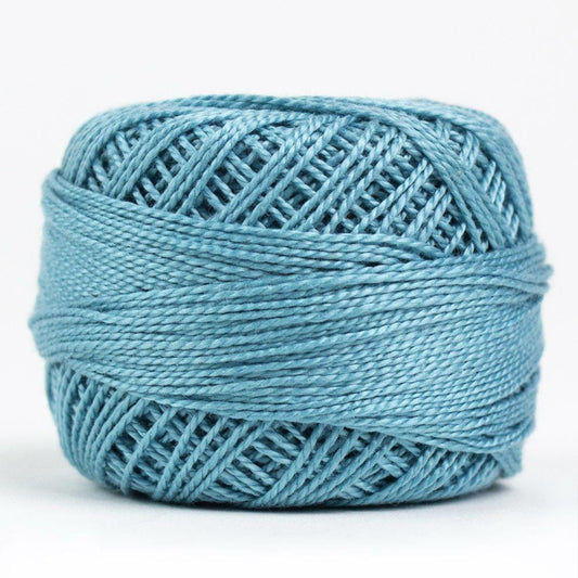 Side view of Perle cotton ball on white background to show color