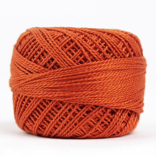 Side view of Perle cotton ball on white background to show color