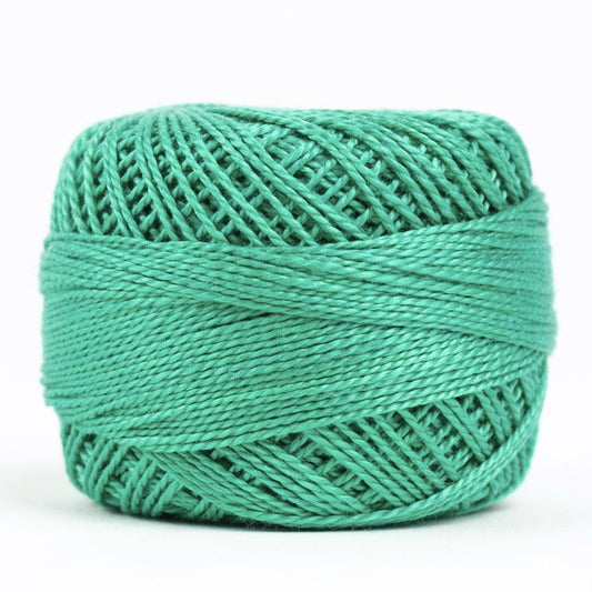 Side view of Perle cotton ball on white background to show color