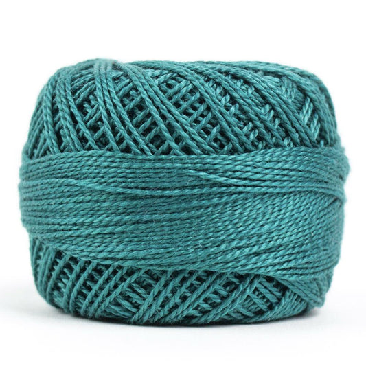 Side view of Perle cotton ball on white background to show color