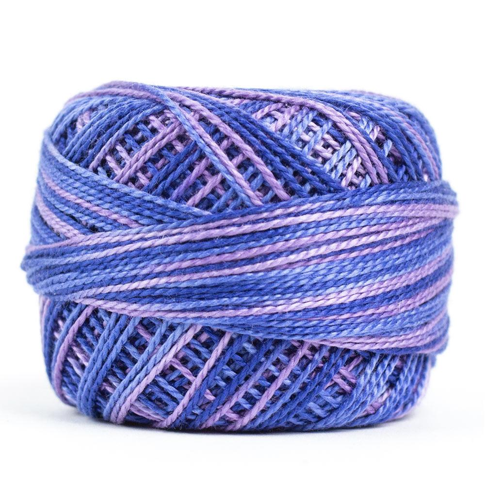 Side view of Perle cotton ball on white background to show color