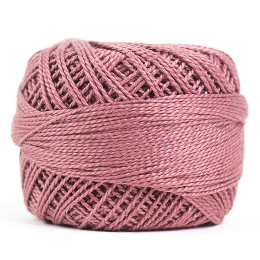 Side view of Perle cotton ball on white background to show color