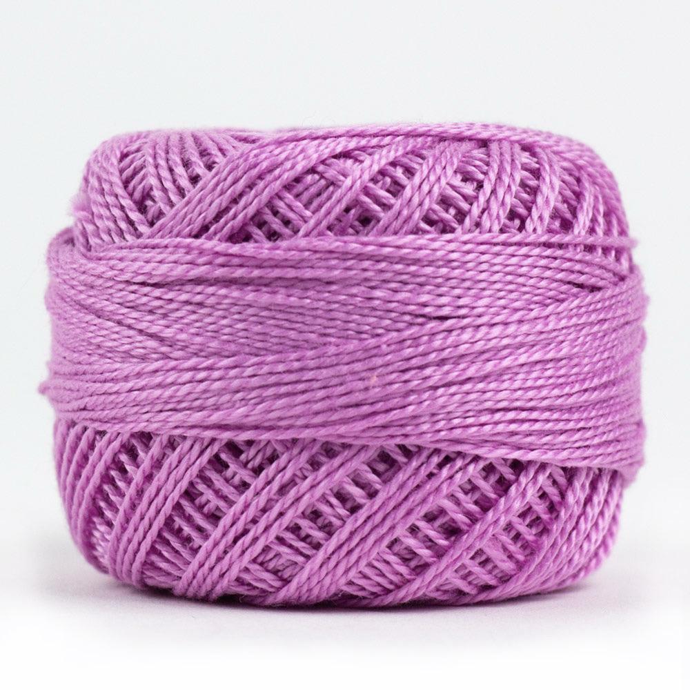 Side view of Perle cotton ball on white background to show color