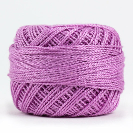 Side view of Perle cotton ball on white background to show color