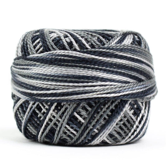 Side view of Perle cotton ball on white background to show color