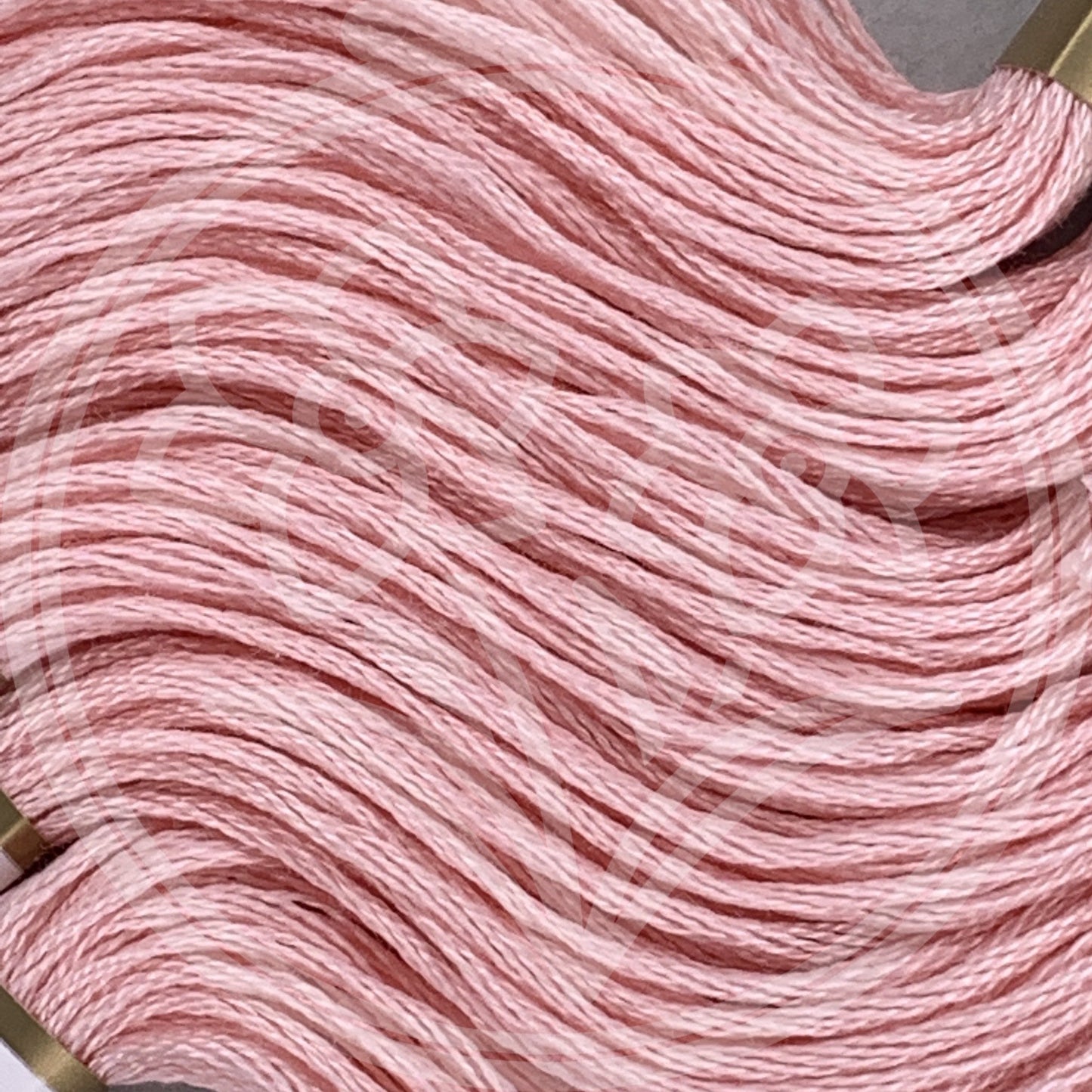 Closeup of multiple skeins, with a logo watermark