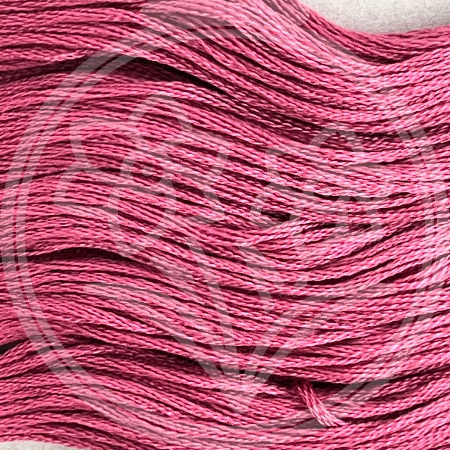 Closeup of multiple skeins, with a logo watermark