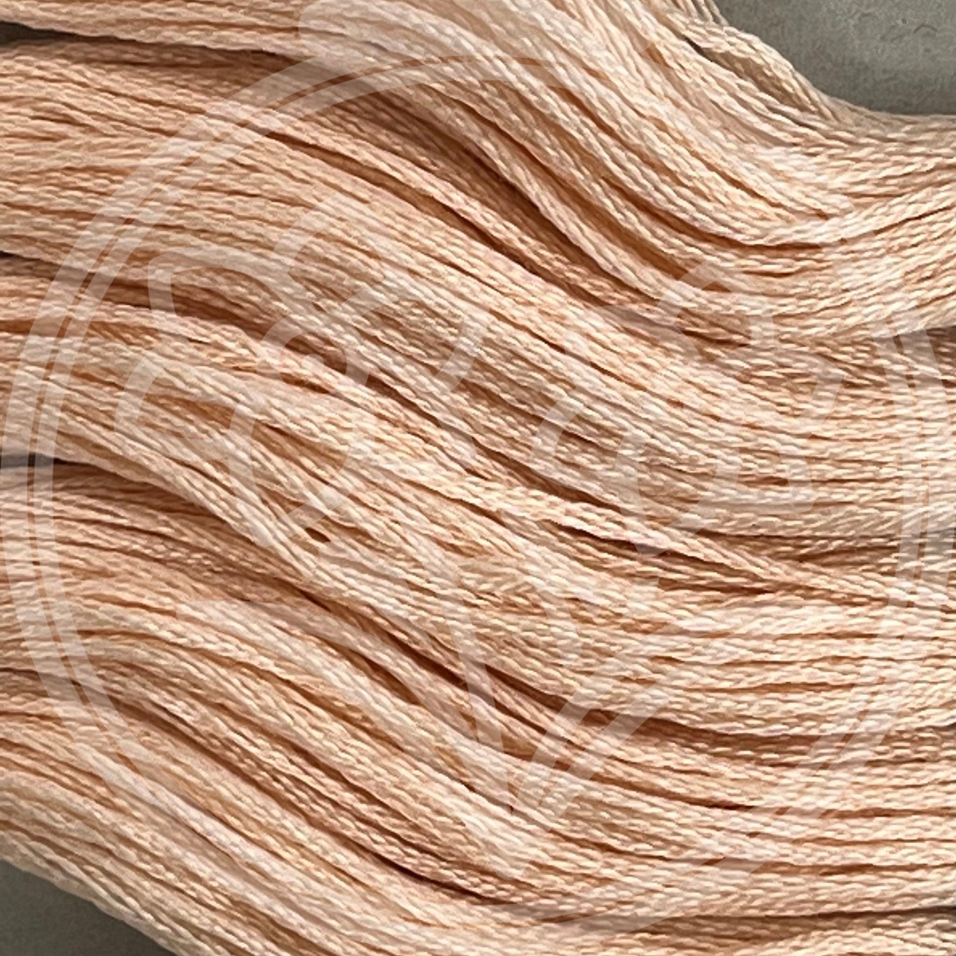 Closeup of multiple skeins, with a logo watermark