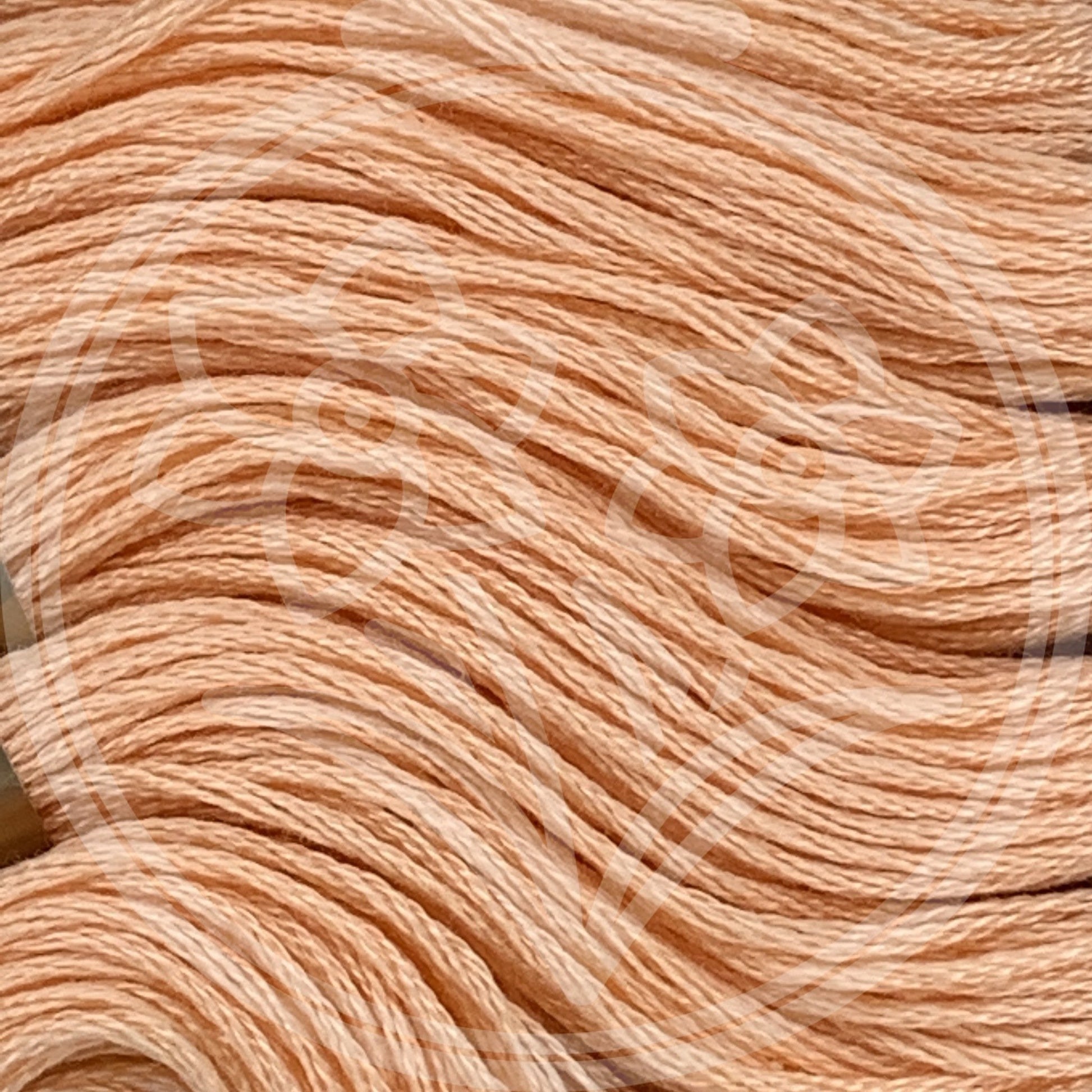 Closeup of multiple skeins, with a logo watermark