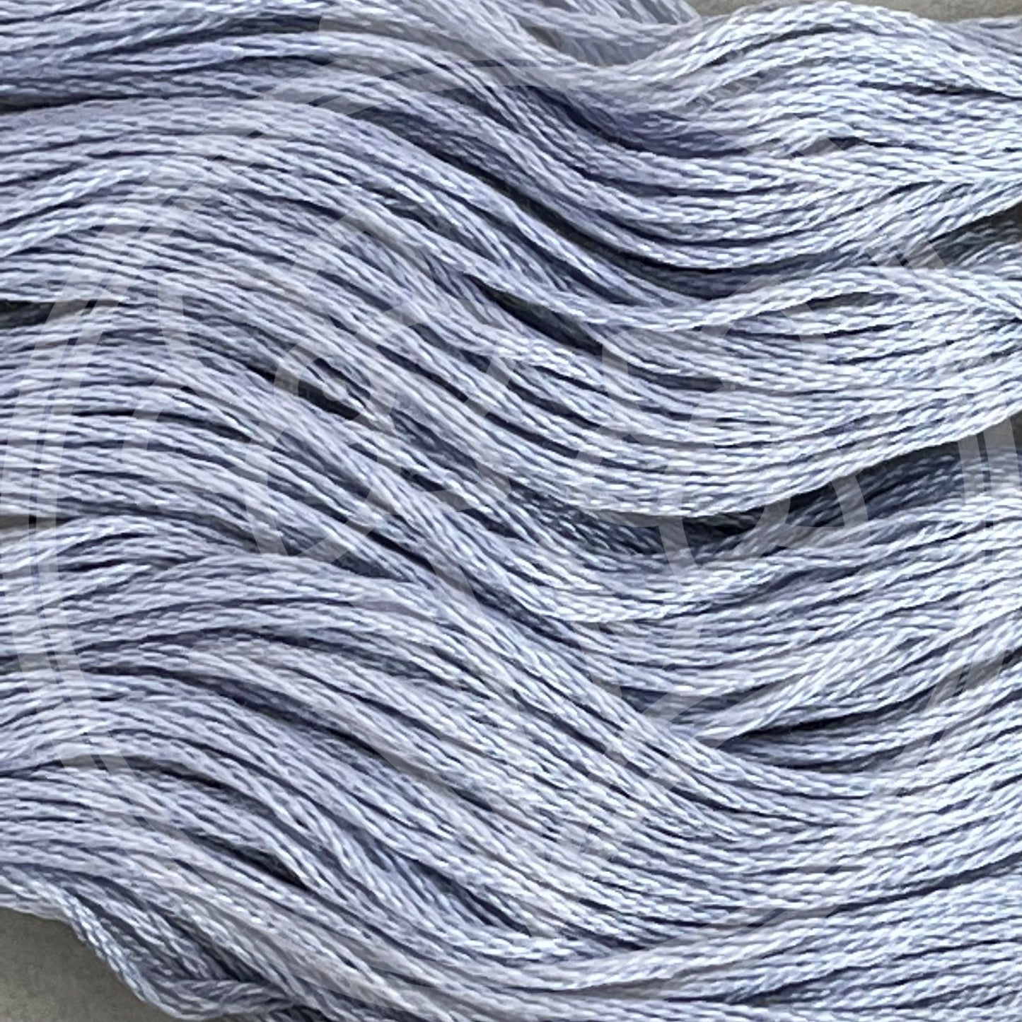 Closeup of multiple skeins, with a logo watermark