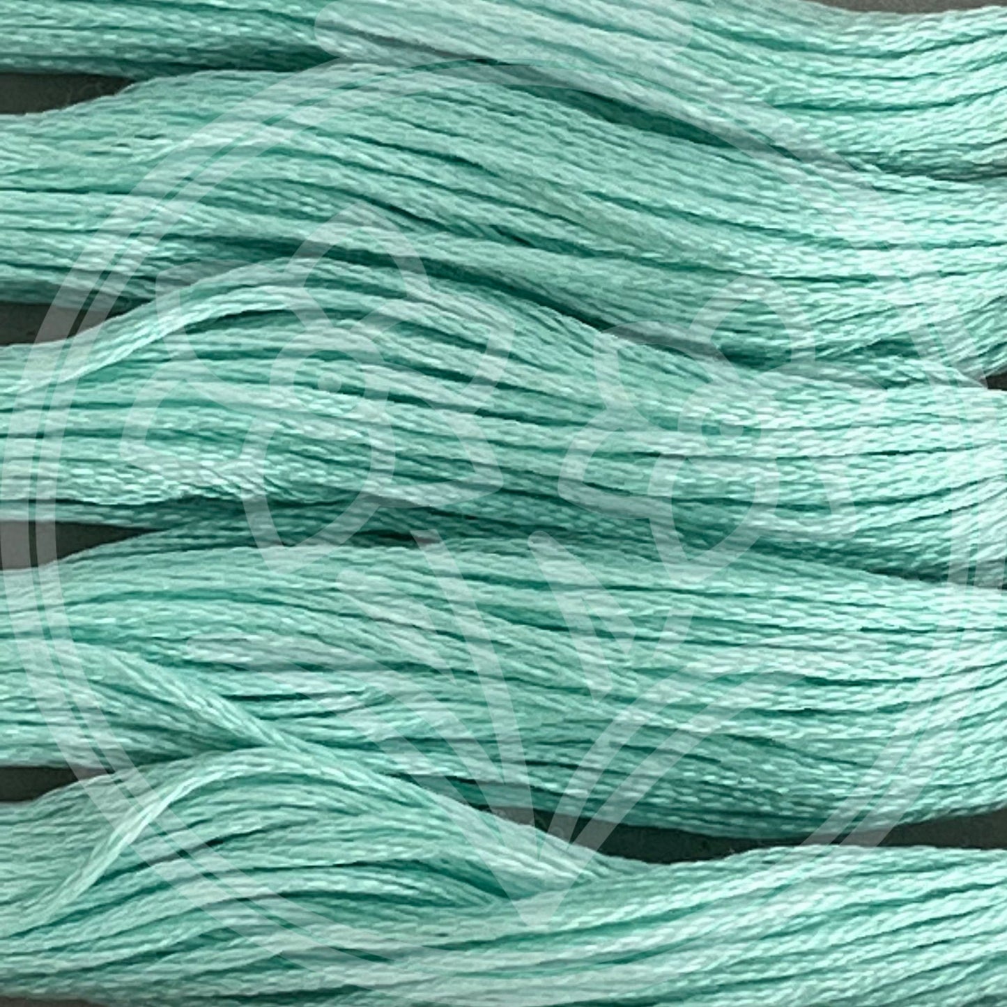 Closeup of multiple skeins, with a logo watermark